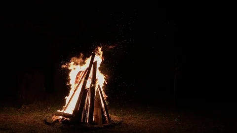 Fire burning in campfire on black background at night Stock Footage 118526689