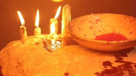 Fire is burning in the dark at night, there is a cup and candles Stock Footage 100741160