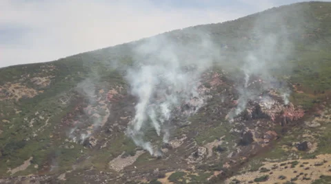 Fire burning down mountain Stock Footage 27816347