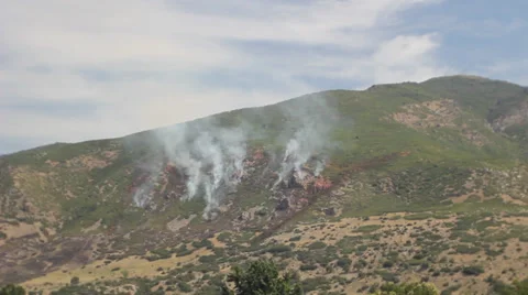 Fire burning down mountain Stock Footage 27816928