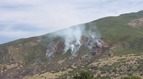 Fire burning down mountain Stock Footage 28297143