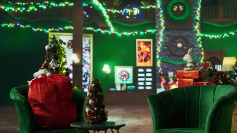 Fire burning in empty room fireplace decorated with Christmas tree Stock Footage 316723315