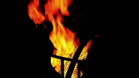Fire Burning in Fire Pit over Black Background Stock Footage 134587576