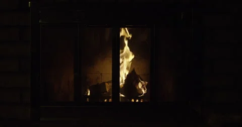 Fire burning in a fire place in to out of focus Stock Footage 56919847