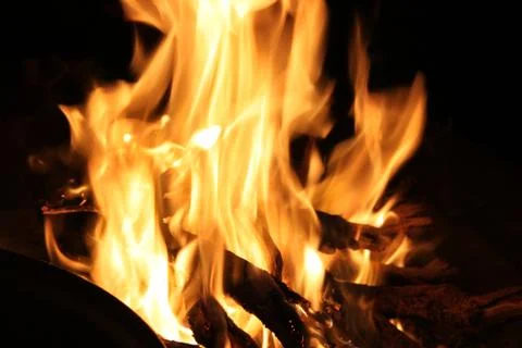 Fire burning in the fireplace close-up Stock Photos