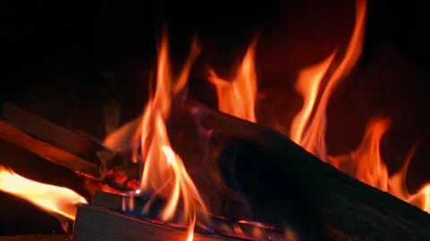 Fire burning in the fireplace, close-up in slow motion Stock Footage 323054709