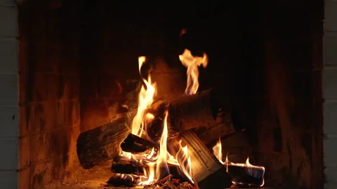Fire Burning in Fireplace. Flames Engulf a Firelighter Nestled Among Charcoals Stockbeeldmateriaal 340879703