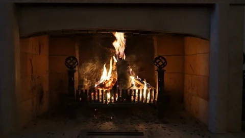 A fire burning in a fireplace Stock Footage 87991074