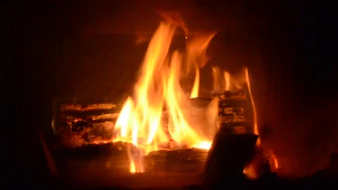 The fire is burning in the fireplace. Stock Footage 220733913