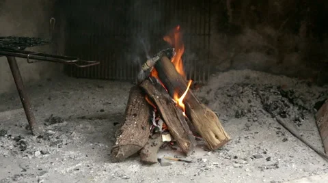 Fire burning in the fireplace in preparation of the barbecue Stock Footage 41471332