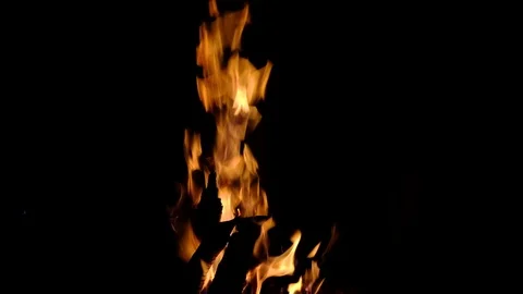 Fire burning in the fireplace. Slow motion video of fire flames over dark bac Video stock 91930446