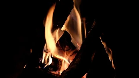 Fire burning in the fireplace. Slow motion video of fire flames over dark bac Video stock 91930469