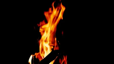 Fire burning in the fireplace. Slow motion video of fire flames over dark bac Stock Footage 91930550