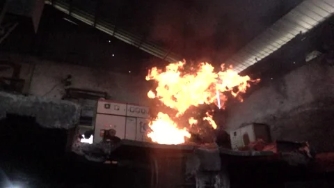 Fire burning in a fireplace with slow motion effect Stock Footage 259863054