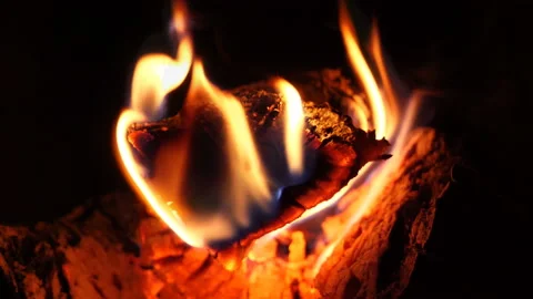 Fire is burning in the fireplace. Warmth and home comfort. Bright fire flames in Stock Footage 146035146