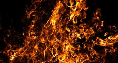 Fire burning flame texture. Fire intense heat glow. Fire abstract energy moti Stock Photos
