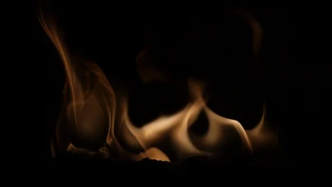 Fire burning in front of black background in slowmotion Stock Footage 98947121