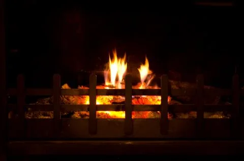 Fire burning in grate Stock Photos
