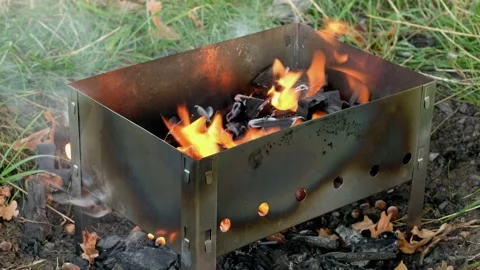 Fire is burning in grill. Cooking meat on coals. Vídeos de archivo 139921180