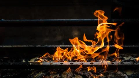Fire burning on grill Foto stock