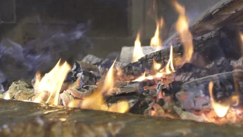 Fire burning in grill. Real fireplace full of wood and fire. Stock Footage 143933177