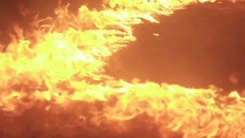 Fire burning in a half-circle in slow motion 動画素材 76800938