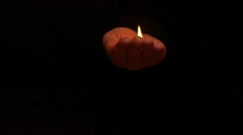 Fire burning in hand slow motion black background Stock Footage 57856947