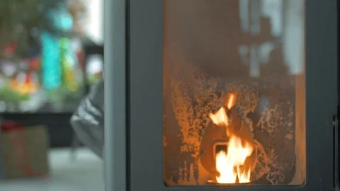 A fire burning in a heater/oven in a restaurant 動画素材 84066463