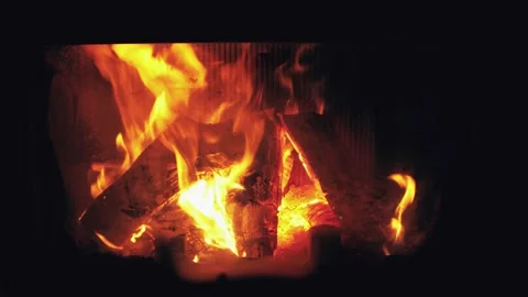 Fire is burning in home fireplace background. Hot orange flames Bonfire in house Stock Footage 146445774