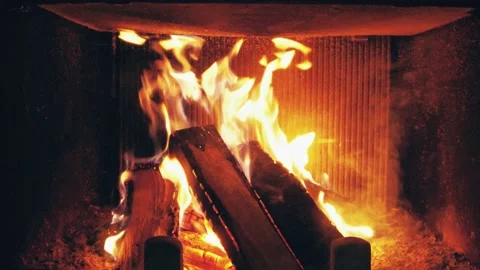 Fire is burning in home fireplace background. Hot orange flames Bonfire in house Stock Footage 146446769
