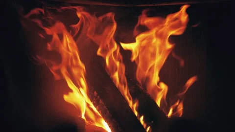 Fire is burning in home fireplace background. Hot orange flames Bonfire in house Stock Footage 146447103