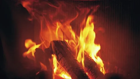 Fire is burning in home fireplace background. Hot orange flames Bonfire in house Stock Footage 146447842