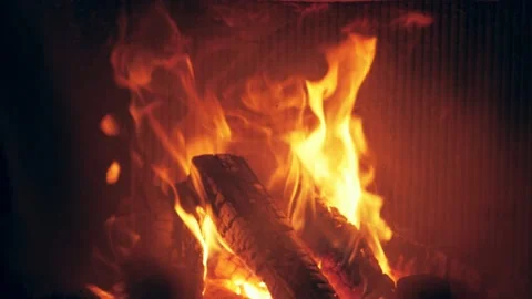 Fire is burning in home fireplace background. Hot orange flames Bonfire in house Stock Footage 146448036