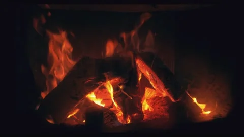 Fire is burning in home fireplace closeup. Hot orange flames. Bonfire in house Stock Footage 146446698