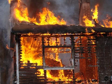 Fire Burning a House Stock Photos