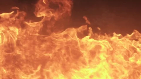 Fire burning in an inferno on the ground, slow motion 動画素材 76800962