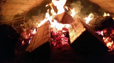 Fire burning inside a old stone oven, at a restaurant kitchen Stock Footage 59617944