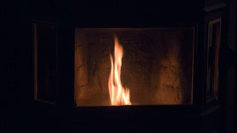 Fire Burning Inside a Pellet Stove at Night Stock Footage 98959773