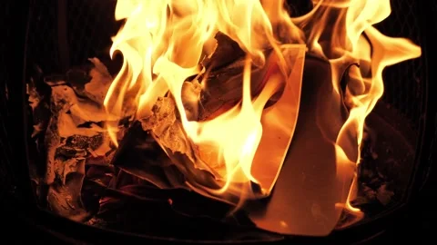 Fire burning with a large photo of a white caucasian child (boy or girl) 库存影片 150339831