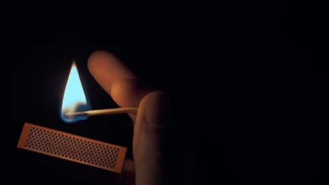 Fire burning on matchstick, isolated on black background. Stock Footage 85907218