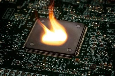 Fire burning micro chip on circuit board with electronic 스톡 사진