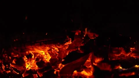 A fire is burning at night sparks fly Stock Footage 137895280