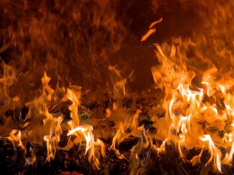 Fire Burning in the Oven During Cooking at Home in the Evening Stock Photos