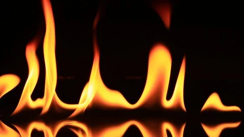Fire Burning Over Black Reflective Surface - Flames Slowly Die Out Stock Footage 104077009