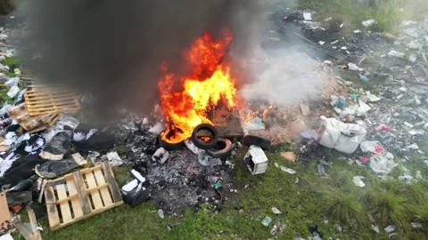 A fire is burning in a pile of trash Stock Footage 314390021