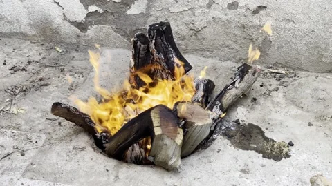 A fire burning in a pit Stock Footage 190388506