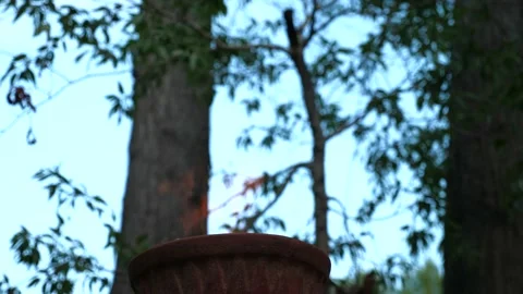 Fire Burning in red clay Chiminea Fireplace Stock Footage 130970687