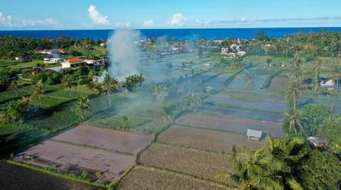 Fire for burning the rubbish caused polution in Bali, Indonesia Stock Photos