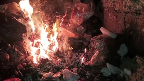 Fire burning rubbish in the dark 6 Stock Footage 327387340