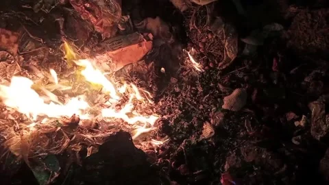 Fire burning rubbish in the dark 7 Stock Footage 327386835
